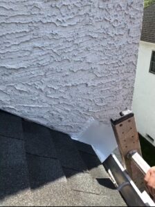 Stucco water leak at a rain gutter repaired