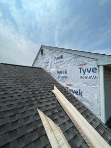 house wrap installed over the paneling wall