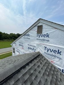 house wrap installed over the paneling wall