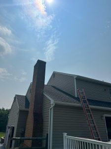 house wrap was installed over the paneling wall, and the siding was reinstalled.